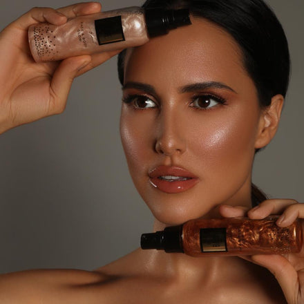 La PIEL Glow Babe Bronze Shimmering Body Mist Model Holding Bottle